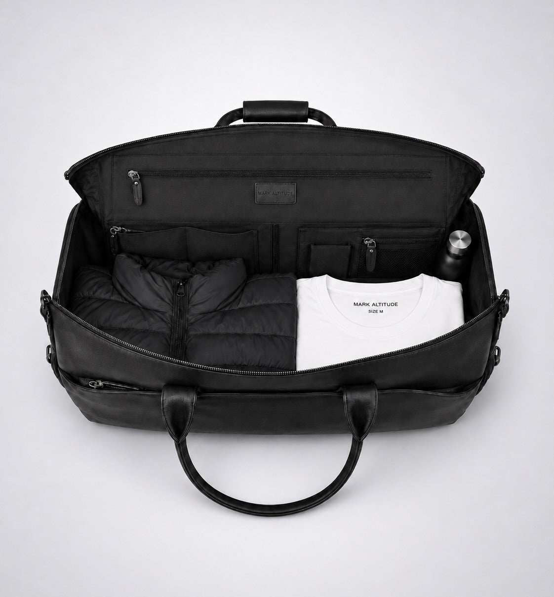 C-01 travel duffel interior with clothing, organizer pockets and bottle